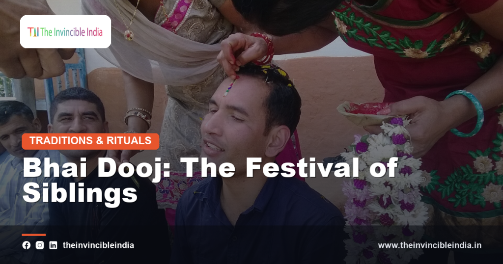 A sister applying tilak on her brother's forehead during Bhai Dooj celebrations
