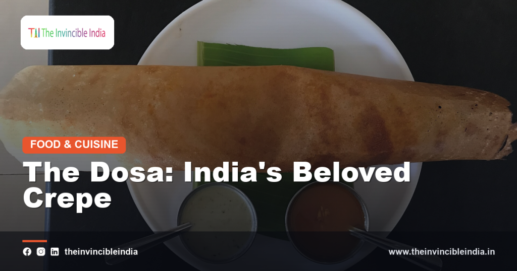 A crispy golden dosa served with chutney and sambar