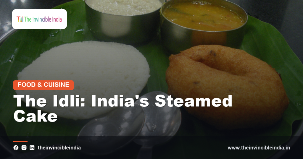 A plate of soft white idlis served with sambar and chutney