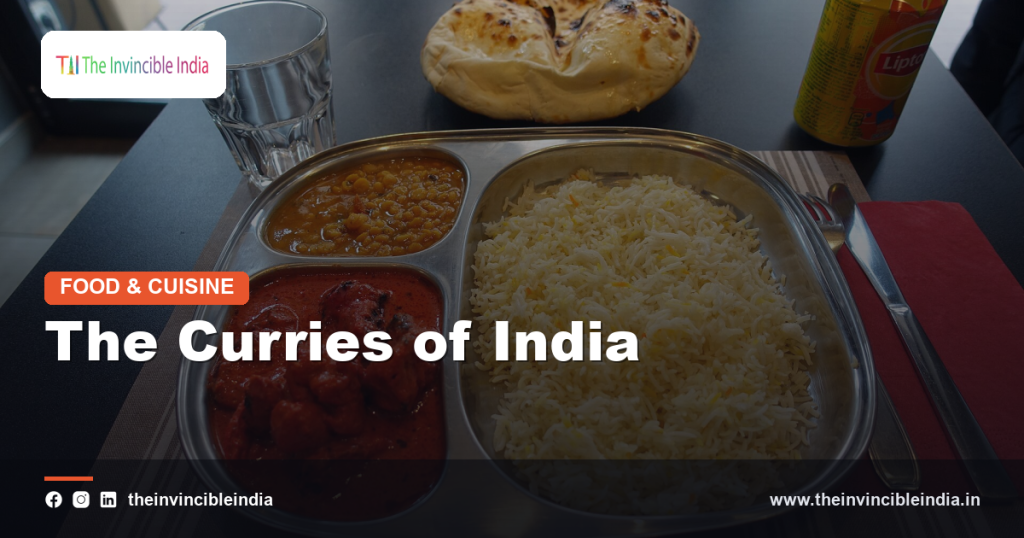 A rich assortment of Indian curries in bowls