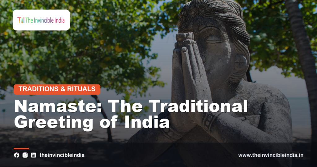 Two people greeting each other with the traditional Namaste gesture