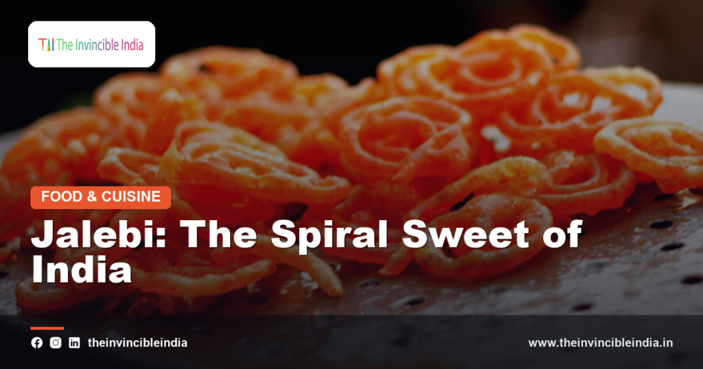 Golden orange jalebi sweets soaked in sugar syrup