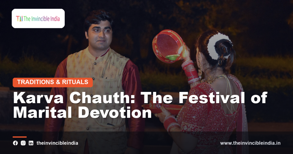 A woman celebrating Karva Chauth with henna and traditional attire