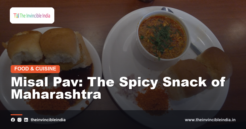 A bowl of spicy misal pav topped with farsan and served with pav bread