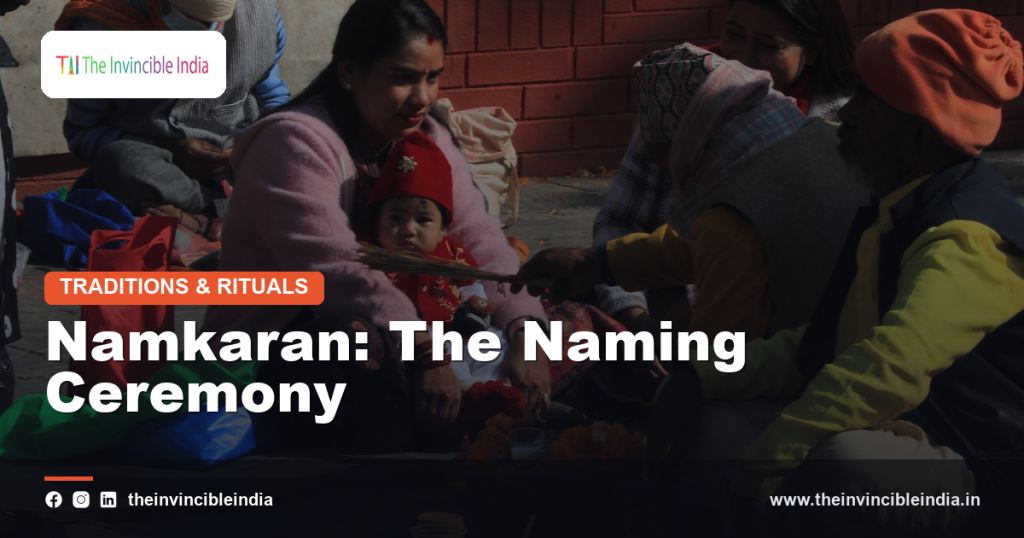 Family members blessing a newborn during a traditional Namkaran ceremony
