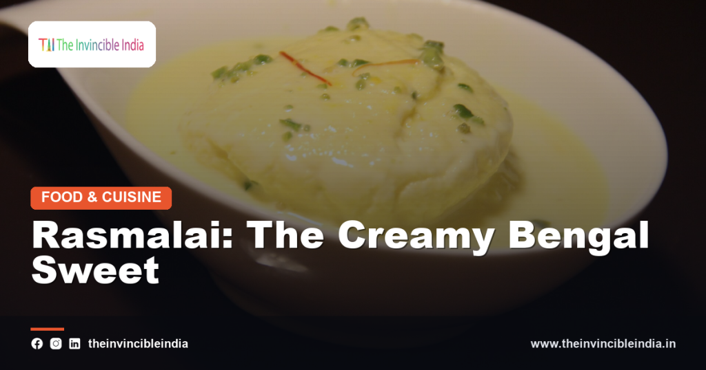 A bowl of rasmalai with soft cottage cheese discs in saffron milk
