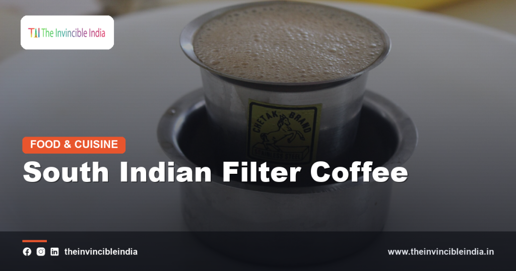A tumbler of frothy South Indian filter coffee