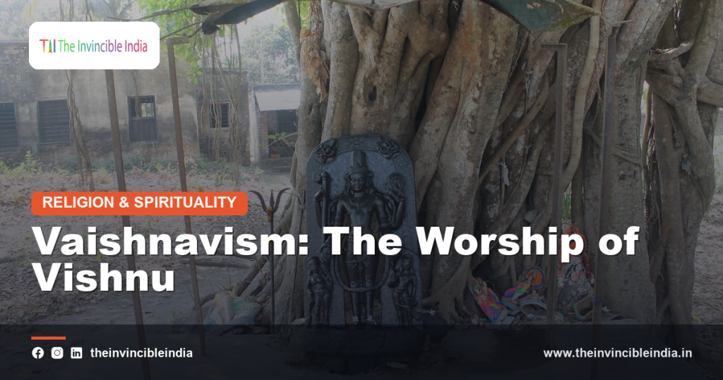 A stone or bronze idol of the Hindu deity Vishnu in a South Indian temple setting